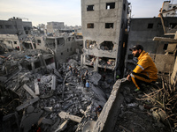 Palestinians inspect the damage after an Israeli strike on the Nuseirat refugee camp in the central Gaza Strip on December 7, 2024, amid the...