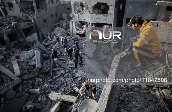 Palestinians inspect the damage after an Israeli strike on the Nuseirat refugee camp in the central Gaza Strip on December 7, 2024, amid the...