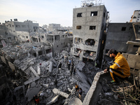 Palestinians inspect the damage after an Israeli strike on the Nuseirat refugee camp in the central Gaza Strip on December 7, 2024, amid the...