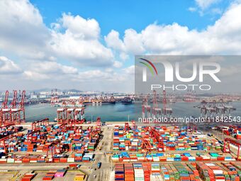 A working scene of a foreign trade container terminal is seen at Qingdao Port in Qingdao, China, on December 7, 2024. (