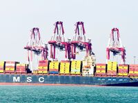 Cargo ships load and unload containers at the foreign trade container terminal in Qingdao Port in Qingdao, China, on December 7, 2024. (