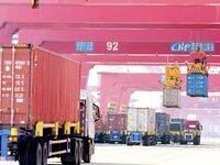 Cargo ships load and unload containers at the foreign trade container terminal in Qingdao Port in Qingdao, China, on December 7, 2024. (