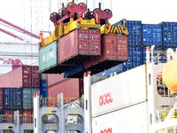 Cargo ships load and unload containers at the foreign trade container terminal in Qingdao Port in Qingdao, China, on December 7, 2024. (