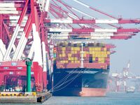 Cargo ships load and unload containers at the foreign trade container terminal in Qingdao Port in Qingdao, China, on December 7, 2024. (