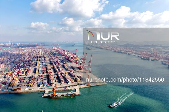 A working scene of a foreign trade container terminal is seen at Qingdao Port in Qingdao, China, on December 7, 2024. 