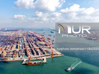 A working scene of a foreign trade container terminal is seen at Qingdao Port in Qingdao, China, on December 7, 2024. (