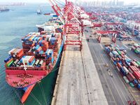 Cargo ships load and unload containers at the foreign trade container terminal in Qingdao Port in Qingdao, China, on December 7, 2024. (