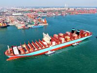 A cargo ship sails towards a foreign trade container terminal at Qianwan Port in Qingdao, China, on December 7, 2024. (