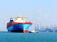 A cargo ship sails towards a foreign trade container terminal at Qianwan Port in Qingdao, China, on December 7, 2024. (