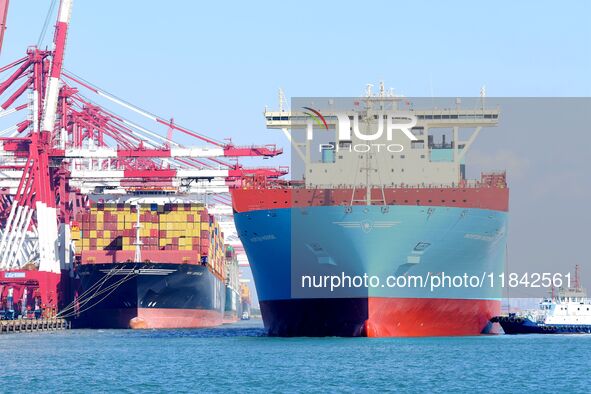 A cargo ship berths at the foreign trade container terminal of Qianwan Port in Qingdao, China, on December 7, 2024. 