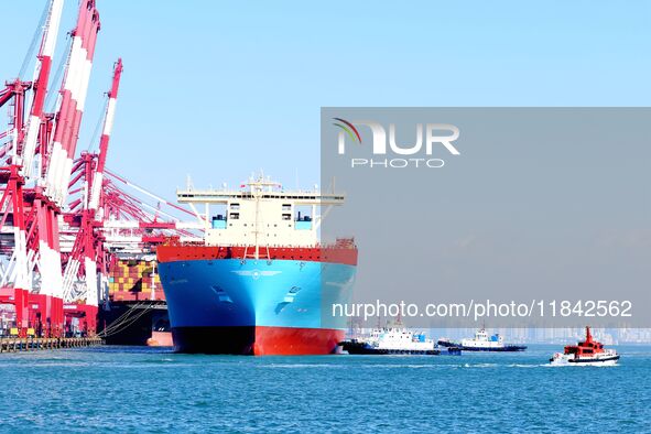 A cargo ship berths at the foreign trade container terminal of Qianwan Port in Qingdao, China, on December 7, 2024. 