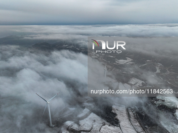 Wind turbines operate at Barren Mountain Wind Farm in Yichang, Hubei province, China, on December 6, 2024. 