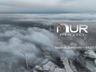 Wind turbines operate at Barren Mountain Wind Farm in Yichang, Hubei province, China, on December 6, 2024. (