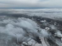 Wind turbines operate at Barren Mountain Wind Farm in Yichang, Hubei province, China, on December 6, 2024. (