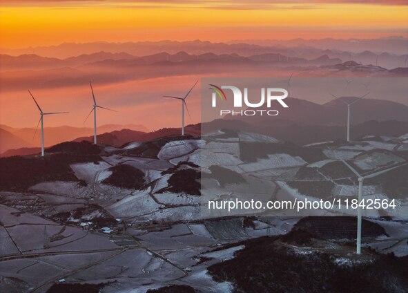 Wind turbines operate at Barren Mountain Wind Farm in Yichang, Hubei province, China, on December 6, 2024. 