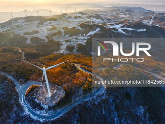 Wind turbines operate at Barren Mountain Wind Farm in Yichang, Hubei province, China, on December 6, 2024. (