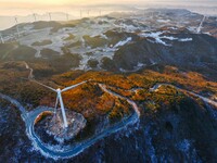 Wind turbines operate at Barren Mountain Wind Farm in Yichang, Hubei province, China, on December 6, 2024. (