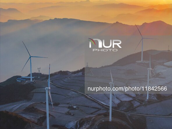 Wind turbines operate at Barren Mountain Wind Farm in Yichang, Hubei province, China, on December 6, 2024. 