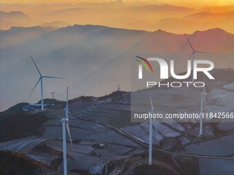 Wind turbines operate at Barren Mountain Wind Farm in Yichang, Hubei province, China, on December 6, 2024. (