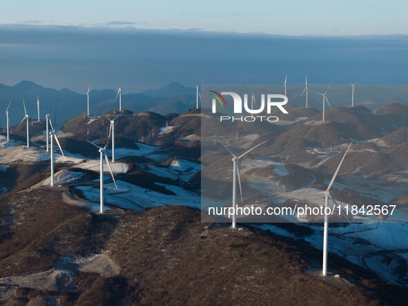 Wind turbines operate at Barren Mountain Wind Farm in Yichang, Hubei province, China, on December 6, 2024. 