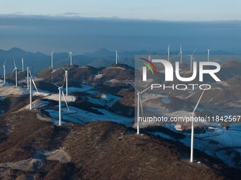 Wind turbines operate at Barren Mountain Wind Farm in Yichang, Hubei province, China, on December 6, 2024. (