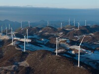 Wind turbines operate at Barren Mountain Wind Farm in Yichang, Hubei province, China, on December 6, 2024. (