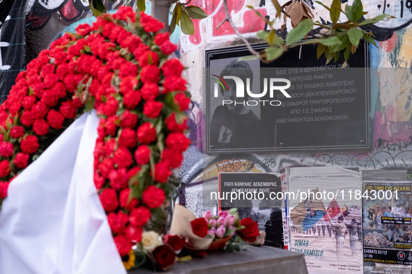 People leave flowers at the monument of Alexis Grigoropoulos in Athens, Greece, on December 6, 2024, marking the 16th anniversary of the dea...