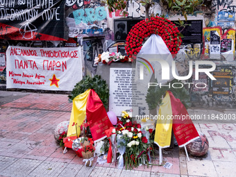 People leave flowers at the monument of Alexis Grigoropoulos in Athens, Greece, on December 6, 2024, marking the 16th anniversary of the dea...