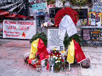 People leave flowers at the monument of Alexis Grigoropoulos in Athens, Greece, on December 6, 2024, marking the 16th anniversary of the dea...