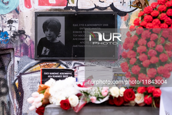 People leave flowers at the monument of Alexis Grigoropoulos in Athens, Greece, on December 6, 2024, marking the 16th anniversary of the dea...