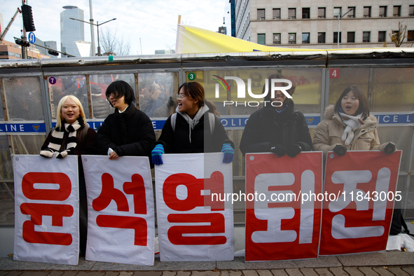 Citizens gather in Yeouido, South Korea, on December 7, 2024, to demand the impeachment and resignation of President Yoon Suk Yeol. Yoon's a...