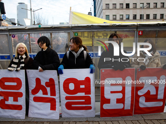 Citizens gather in Yeouido, South Korea, on December 7, 2024, to demand the impeachment and resignation of President Yoon Suk Yeol. Yoon's a...