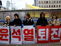 Citizens gather in Yeouido, South Korea, on December 7, 2024, to demand the impeachment and resignation of President Yoon Suk Yeol. Yoon's a...