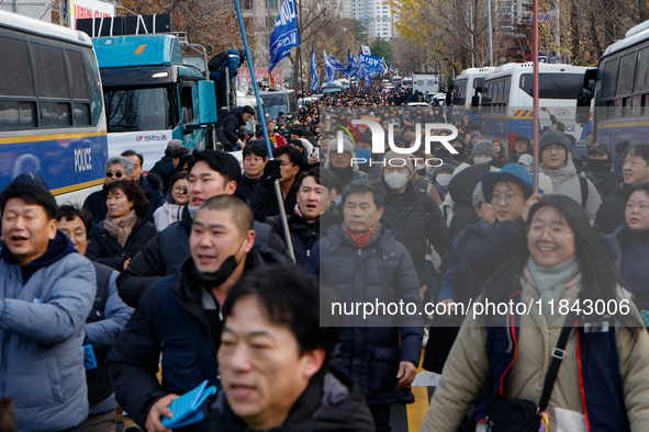 Citizens gather in Yeouido, South Korea, on December 7, 2024, to demand the impeachment and resignation of President Yoon Suk Yeol. Yoon's a...