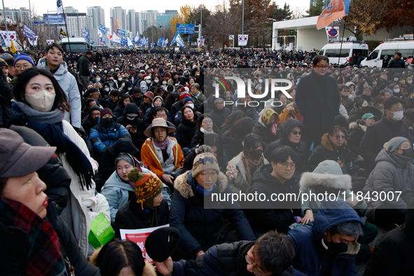 Citizens gather in Yeouido, South Korea, on December 7, 2024, to demand the impeachment and resignation of President Yoon Suk Yeol. Yoon's a...