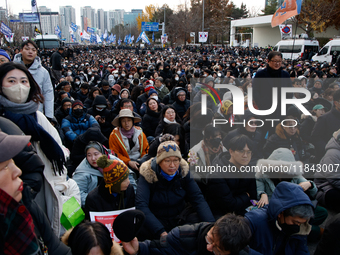 Citizens gather in Yeouido, South Korea, on December 7, 2024, to demand the impeachment and resignation of President Yoon Suk Yeol. Yoon's a...