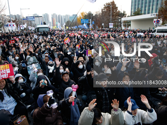 Citizens gather in Yeouido, South Korea, on December 7, 2024, to demand the impeachment and resignation of President Yoon Suk Yeol. Yoon's a...