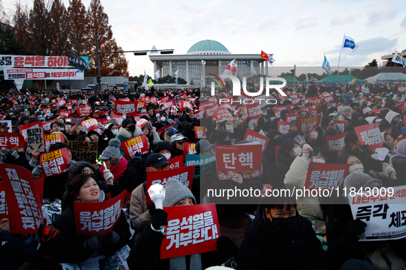 Citizens gather in Yeouido, South Korea, on December 7, 2024, to demand the impeachment and resignation of President Yoon Suk Yeol. Yoon's a...