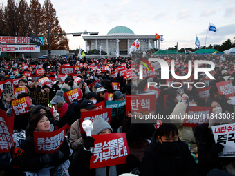 Citizens gather in Yeouido, South Korea, on December 7, 2024, to demand the impeachment and resignation of President Yoon Suk Yeol. Yoon's a...