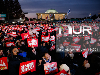 Citizens gather in Yeouido, South Korea, on December 7, 2024, to demand the impeachment and resignation of President Yoon Suk Yeol. Yoon's a...