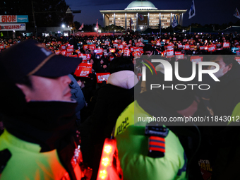 Citizens gather in Yeouido, South Korea, on December 7, 2024, to demand the impeachment and resignation of President Yoon Suk Yeol. Yoon's a...