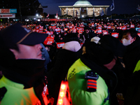 Citizens gather in Yeouido, South Korea, on December 7, 2024, to demand the impeachment and resignation of President Yoon Suk Yeol. Yoon's a...