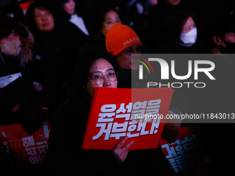 Citizens gather in Yeouido, South Korea, on December 7, 2024, to demand the impeachment and resignation of President Yoon Suk Yeol. Yoon's a...