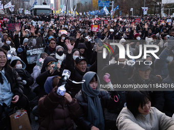 Citizens gather in Yeouido, South Korea, on December 7, 2024, to demand the impeachment and resignation of President Yoon Suk Yeol. Yoon's a...