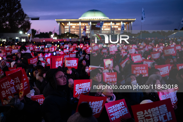 Citizens gather in Yeouido, South Korea, on December 7, 2024, to demand the impeachment and resignation of President Yoon Suk Yeol. Yoon's a...