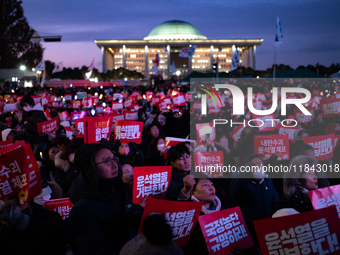 Citizens gather in Yeouido, South Korea, on December 7, 2024, to demand the impeachment and resignation of President Yoon Suk Yeol. Yoon's a...