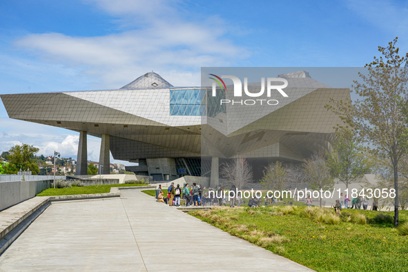 School classes and visitors gather at the Musée des Confluences in Lyon, France, on April 4, 2024. The museum stands prominently with its st...