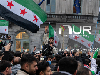 A representation of the Syrian people waves Syrian flags and chants for freedom, demonstrating in front of the European Parliament in Brusse...