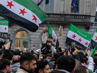 A representation of the Syrian people waves Syrian flags and chants for freedom, demonstrating in front of the European Parliament in Brusse...