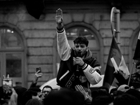 A representation of the Syrian people waves Syrian flags and chants for freedom in front of the European Parliament in Brussels, Belgium, on...